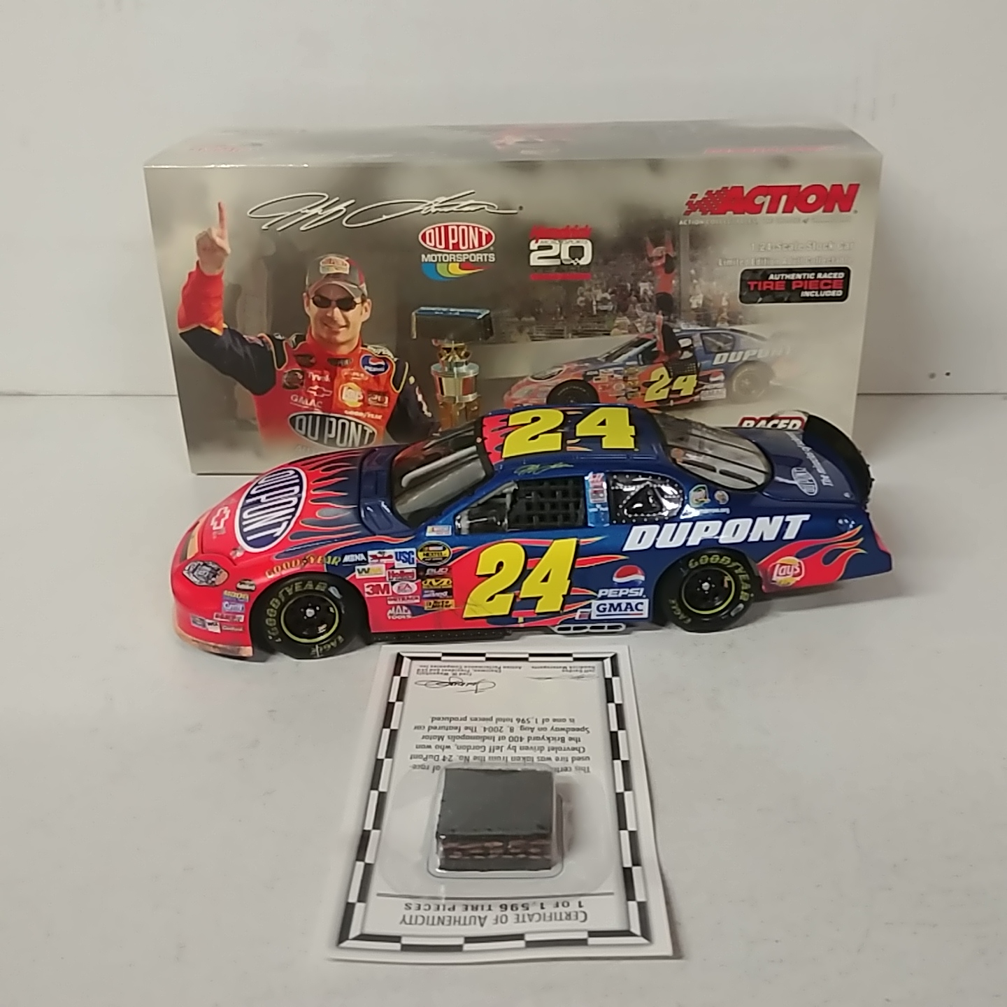 2004 Jeff Gordon 1/24th Dupont "Brickyard Win" c/w car with race used piece of tire