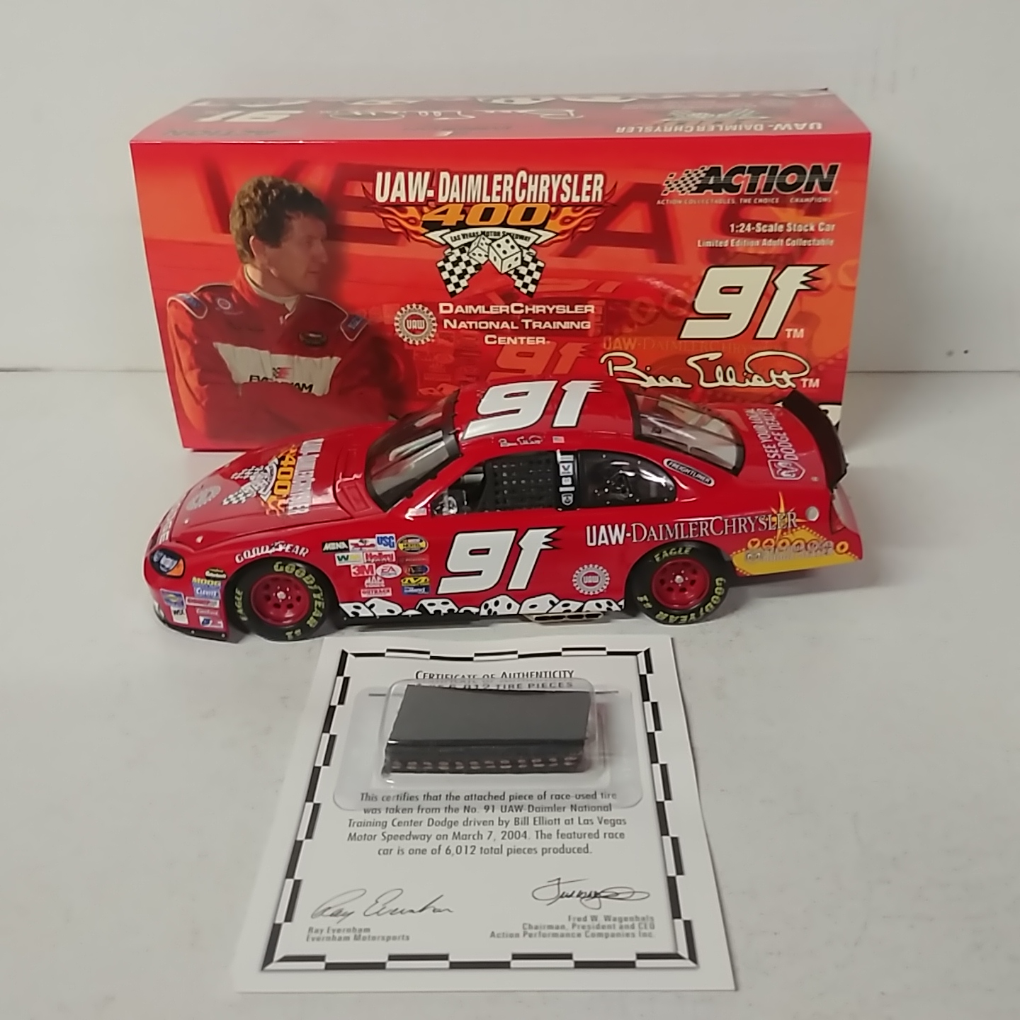 2004 Bill Elliott 1/24th UAW Damler Chrysler c/w car with raced used tire piece